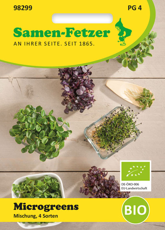 Vorderseite einer Samen-Fetzer Packung Microgreens, Mischung aus 4 Sorten, mit Bio-Label und EU-Bio-Logo; Darstellung mehrerer frischer Microgreens auf hellem Holzuntergrund
