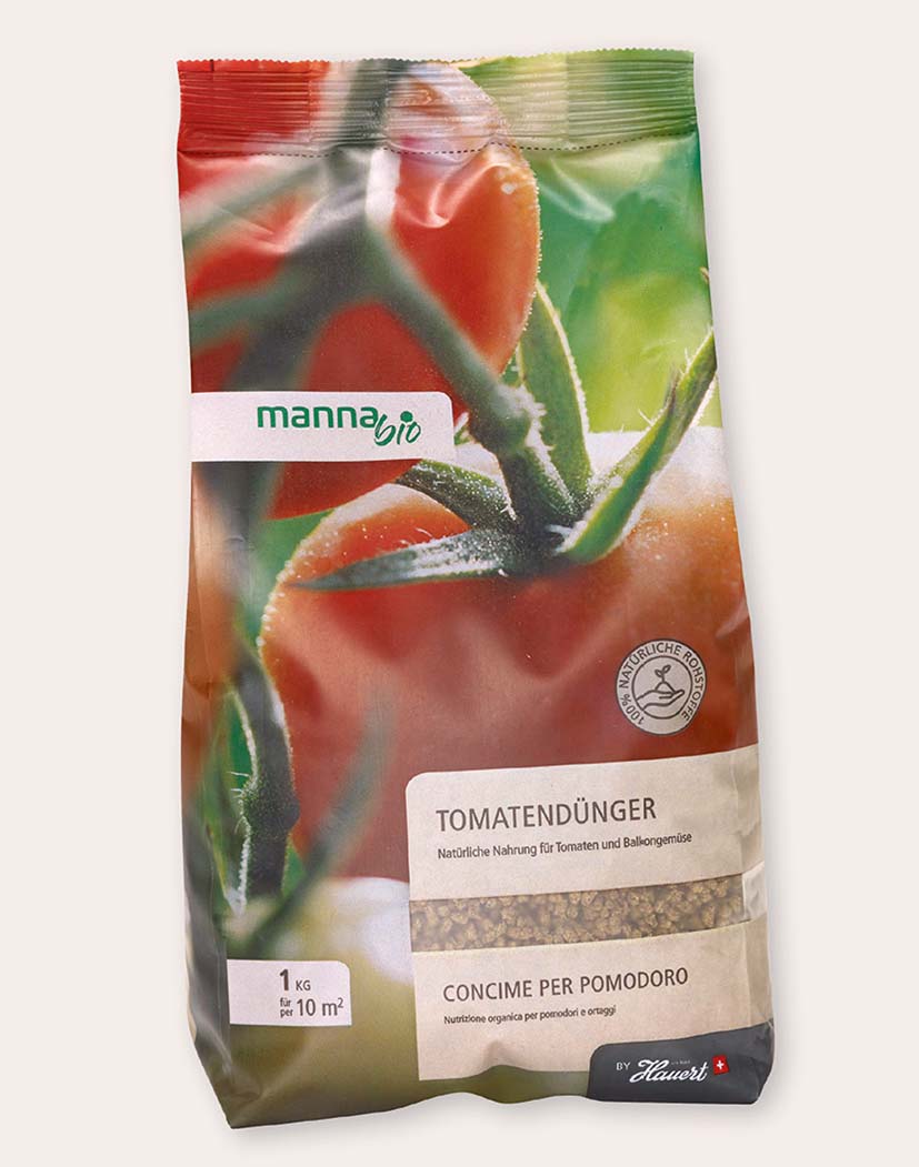Packung Tomatendünger von manna bio, 1 kg, organischer Körnerdünger für Tomaten und Balkongemüse; Verpackung mit großem Tomatenmotiv