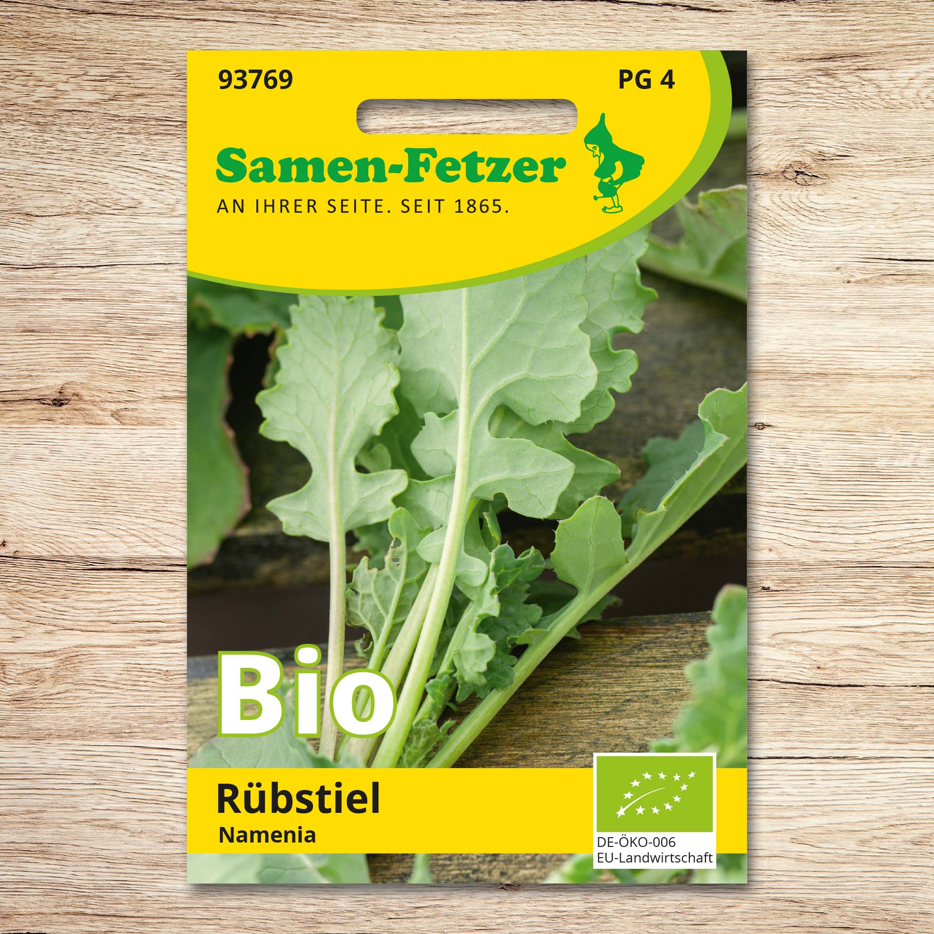 Saatgutverpackung Bio Rübstiel Namenia von Samen-Fetzer mit frischen grünen Blättern; ertragreiches Blattstielgemüse mit mild-würzigem Kohlgeschmack, ideal als Salat oder Kochgemüse, Mehrfachernte möglich.