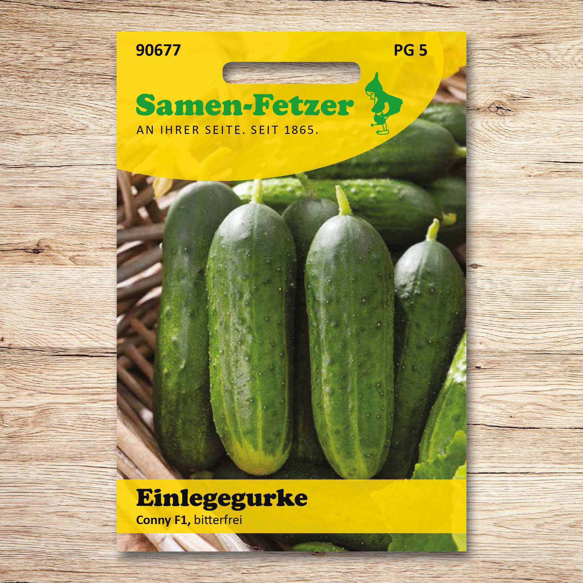 Saatgutpackung von Samen-Fetzer für Einlegegurken Conny F1 mit dunkelgrünen, walzenförmigen Gurken – bitterfreie, ertragreiche, robuste Sorte für den Garten