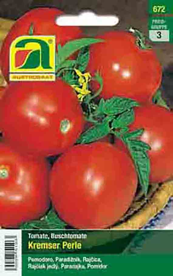 Vorderseite einer Samenpackung 'Kremser Perle' (Buschtomate) mit mehreren reifen, roten, runden Tomaten und grünen Blättern